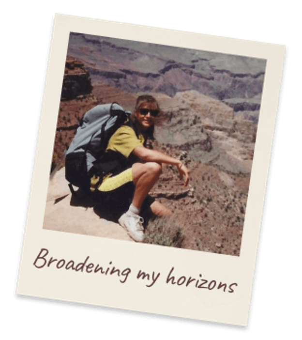 Broadening my horizons. Margie backpacking, crouched on a red rock ledge above the Grand Canyon.