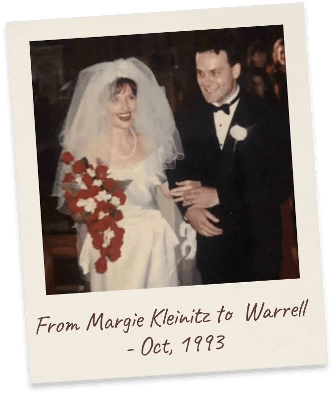 From Margie Kleinitz to Warrell - Oct, 1993. The 1993 wedding photograph: bride in a full veil with a cascading red-and-white bouquet beside the groom in black tie.