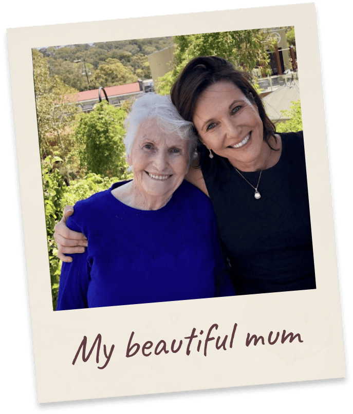 My beautiful mum. Margie with her arm around her elderly mother, outdoors on a sunny hillside.